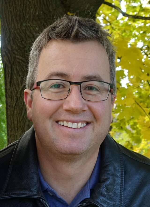 A headshot of Tom Homer.