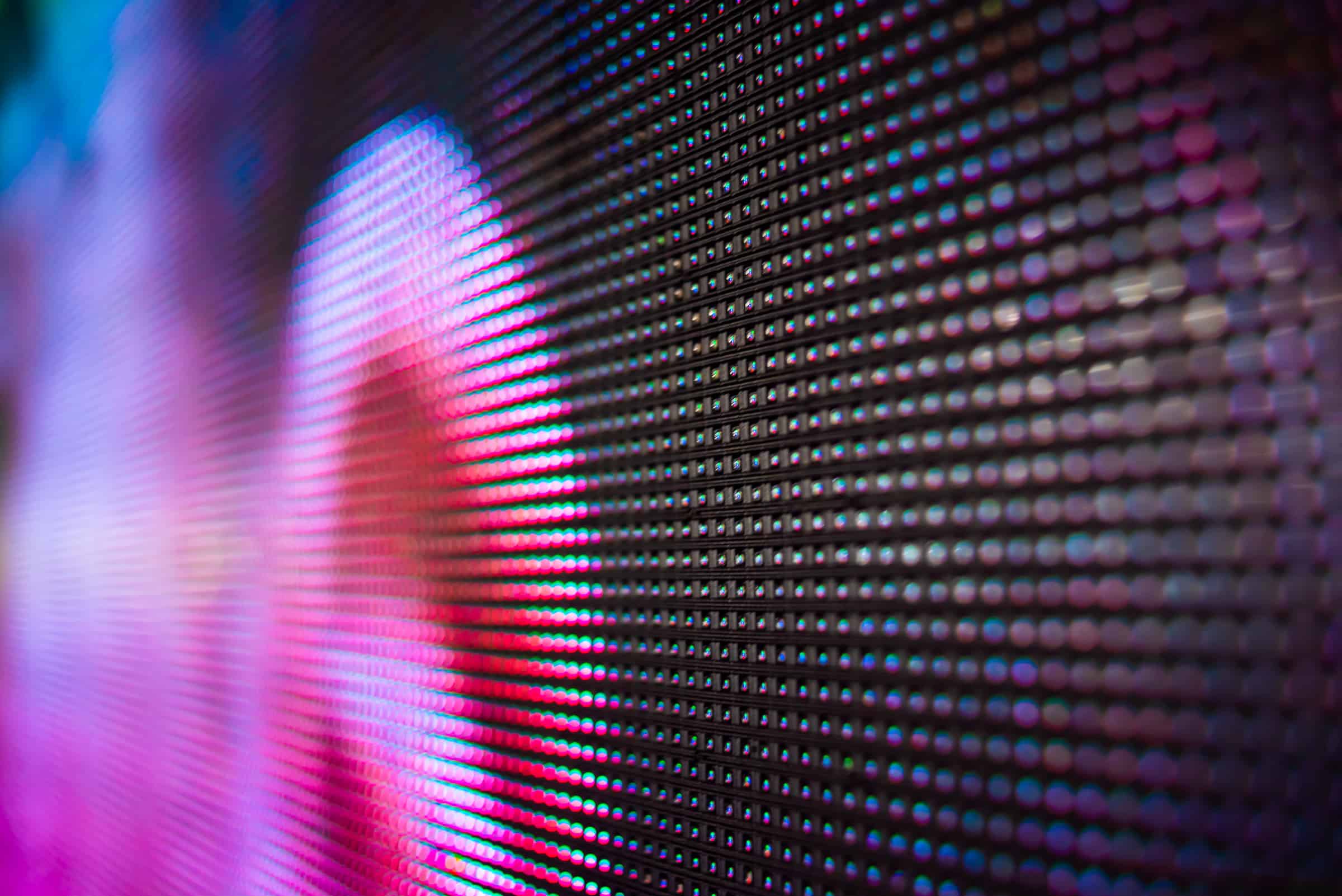 A close up of a projection screen showing how the image of an ear is made up of small pixels.